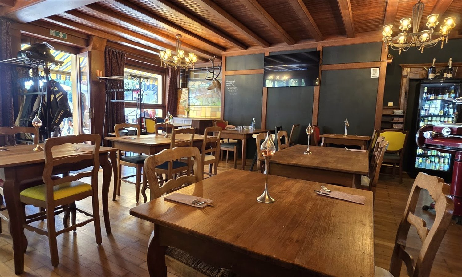 Dining room with wooden beams and blackboard menu